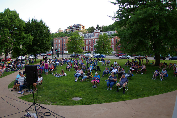 Community members gather from Iowa, Illinois, and Wisconsin to remember loved ones.